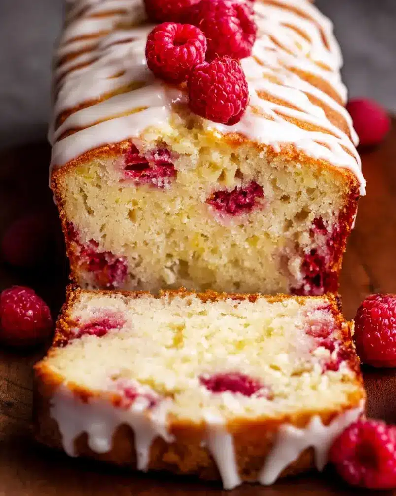 Glazed White Chocolate Raspberry Loaf 3 Raspberry loaf cooling on a wire rack before glazing